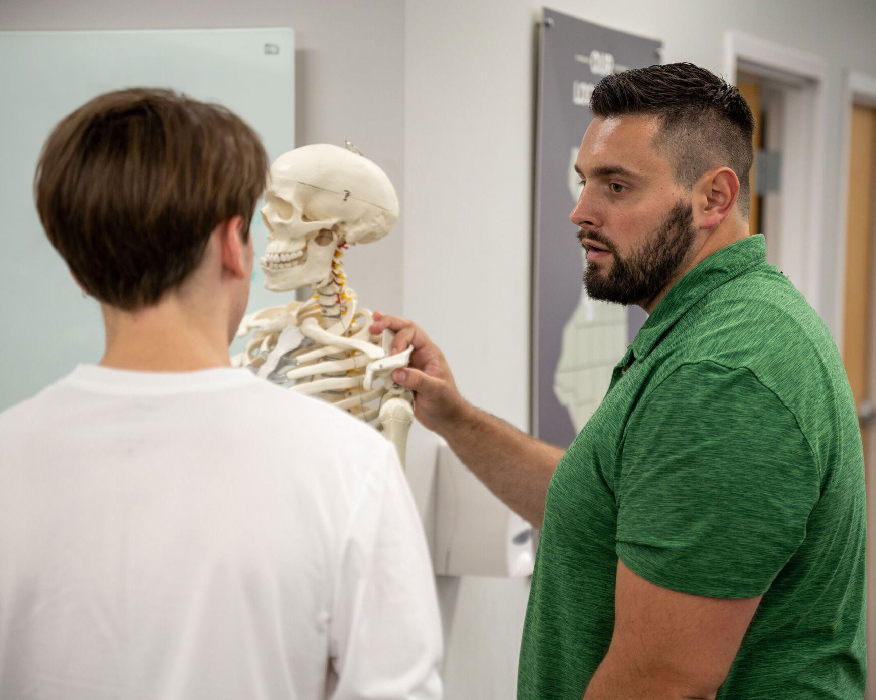A Physical Therapist educates a head & neck patient.