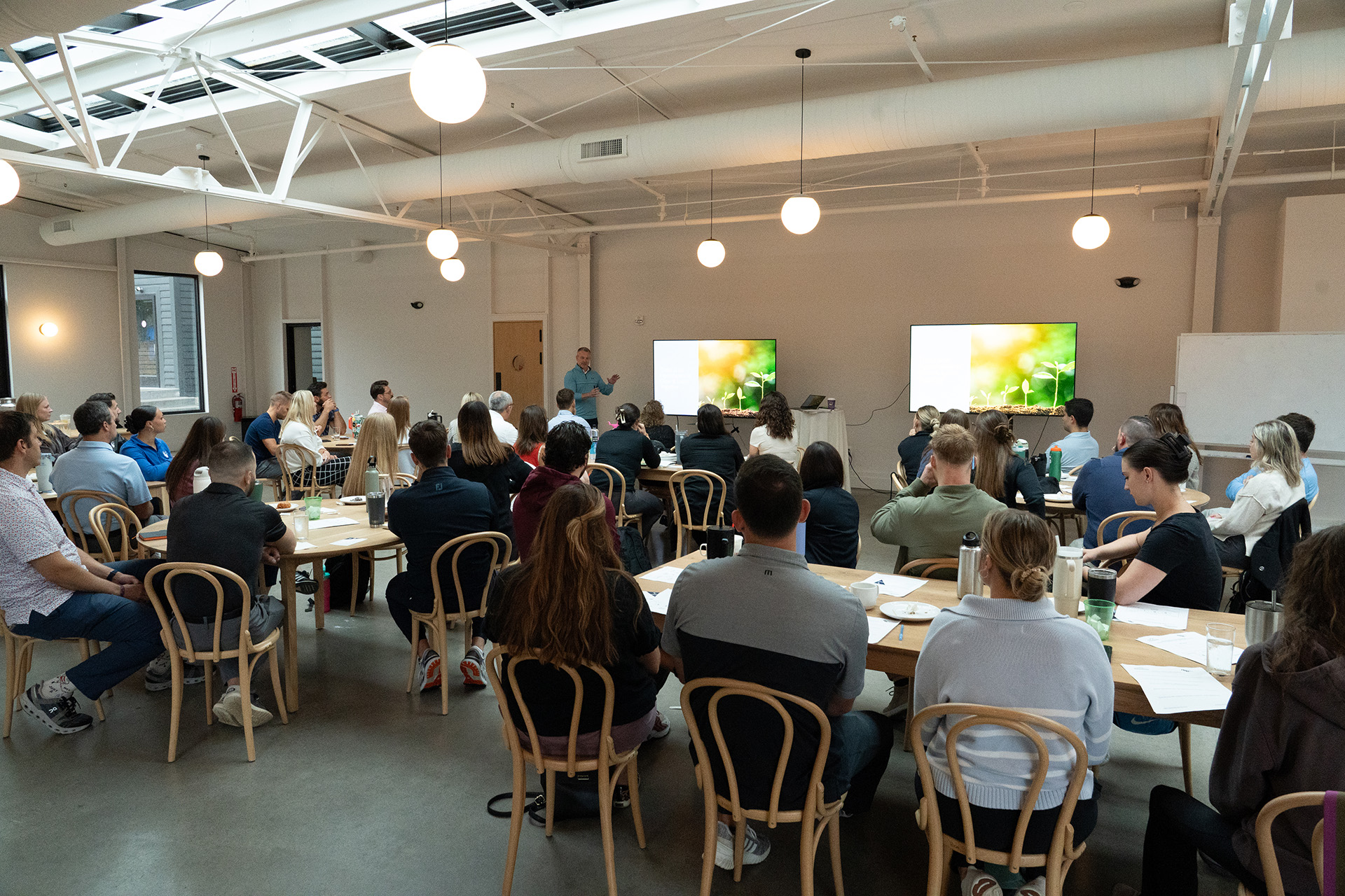 2025 BRG Leadership Retreat attendees listening to a presentation from Leadership Coach Mike Osler.